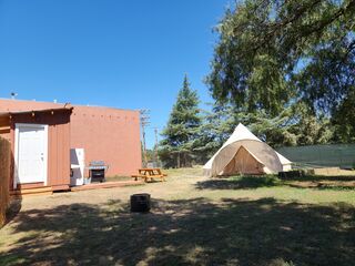 Full bathroom and showers inside the brown shed.