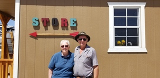 Glenn & Carolin in front of store