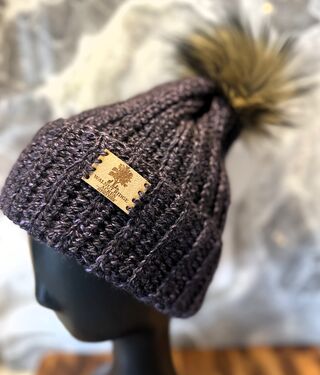 Photo of Purple & Black Multi Pom Pom Hat